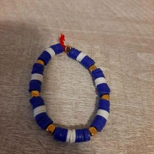 Purple and white claybead bracelet